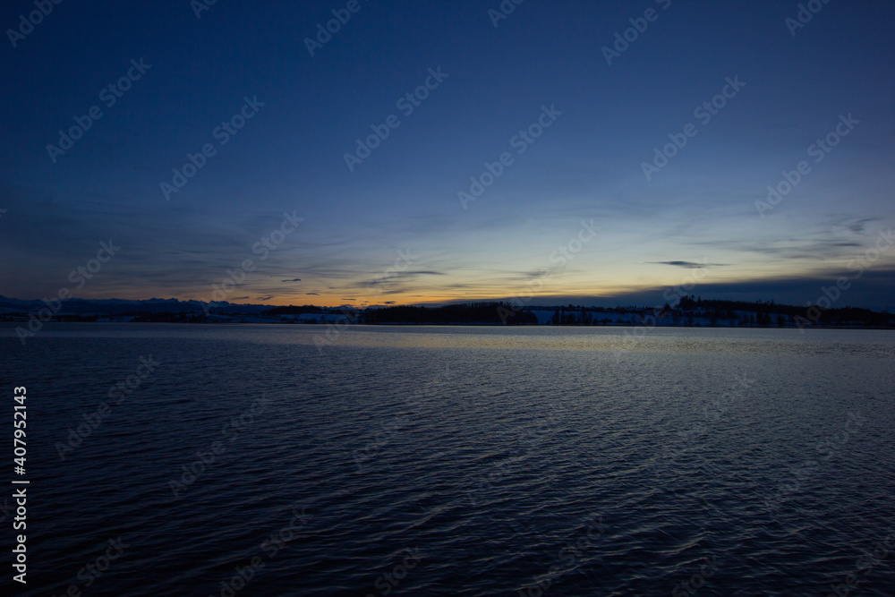 Fototapeta premium winter evening mood at the lake of pfaeffikon (Pfäffikersee)