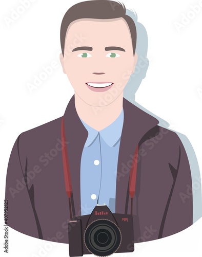 A male photographer in a dark coat and blue shirt smiles and looks forward. A SLR camera with a red strap hangs on his neck.