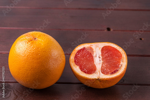 Close up view of grapefruit isolated on wood background. Healthy eating  food concept. Beautiful nature backgrounds.