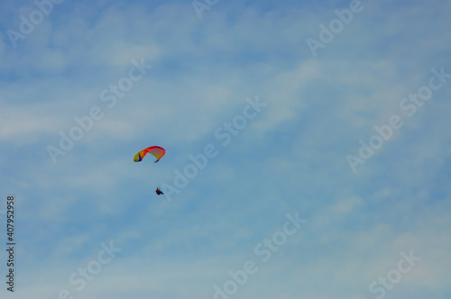 paraglider on the blue sky background
