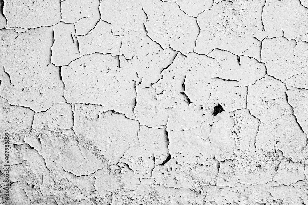 Texture of a concrete wall with cracks and scratches which can be used as a background