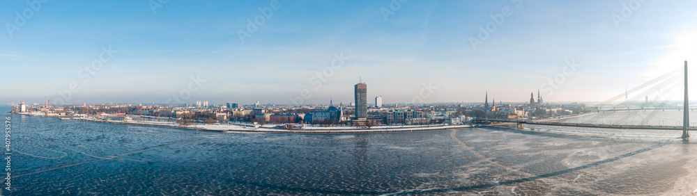 Aerial Panorama view of the Vansu bridge and Old Riga over Daugava river in Winter