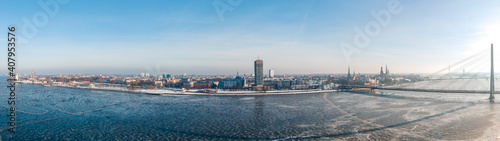Aerial Panorama view of the Vansu bridge and Old Riga over Daugava river in Winter