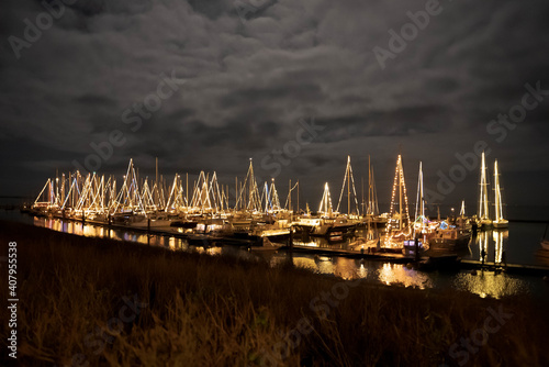 High angle shot of the Terschelling harbor decorated with Christmas lights in the Netherlands photo