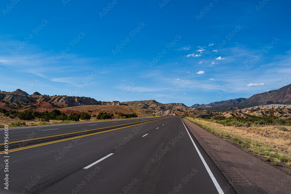 Highway on travel vacation. Panoramic skyline with empty road.