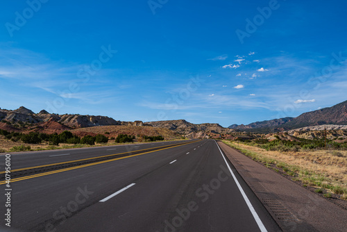 Highway on travel vacation. Panoramic skyline with empty road.