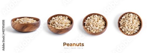 Peanuts in wooden bowl isolated on a white background.