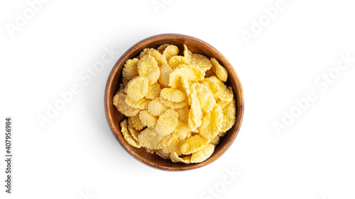 Flakes in wooden bowl isolated on a white background.