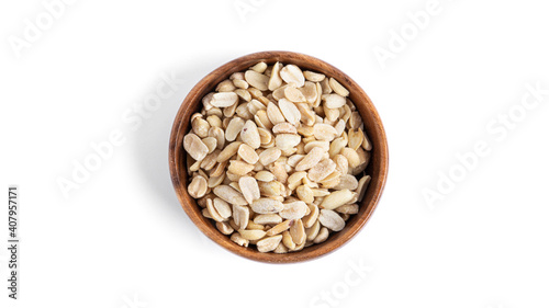 Peanuts in wooden bowl isolated on a white background.