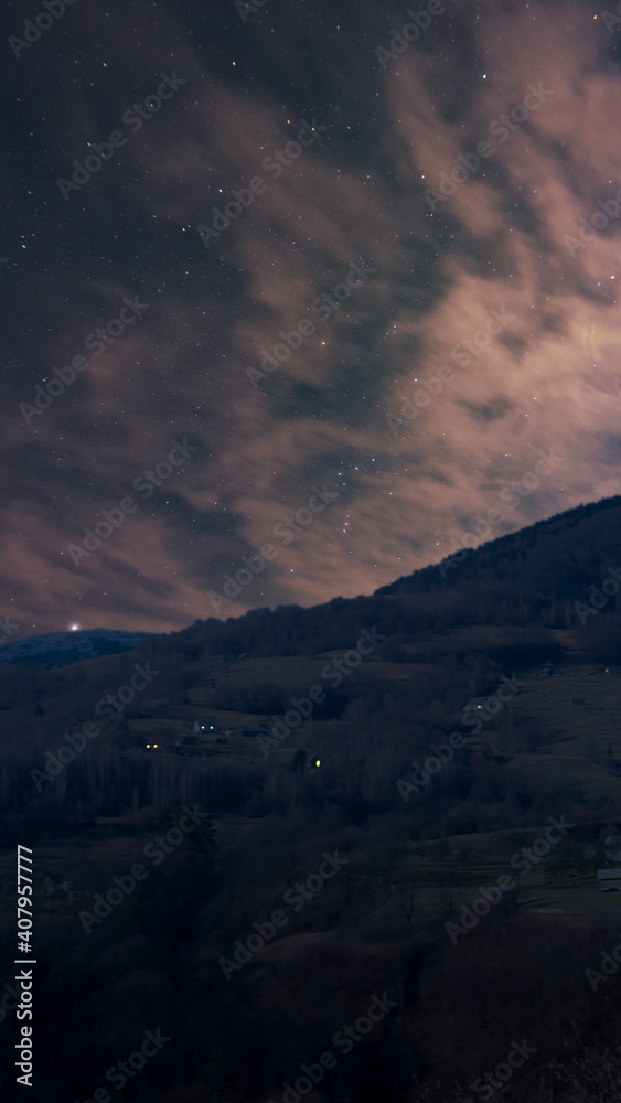 Starry sky over the mountain. Orion and mountain