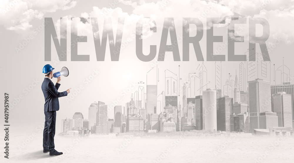 Young businessman with hard hat and NEW CAREER inscription, new business opportunity concept Young businessman with hard hat and NEW CAREER inscription, new business opportunity concept