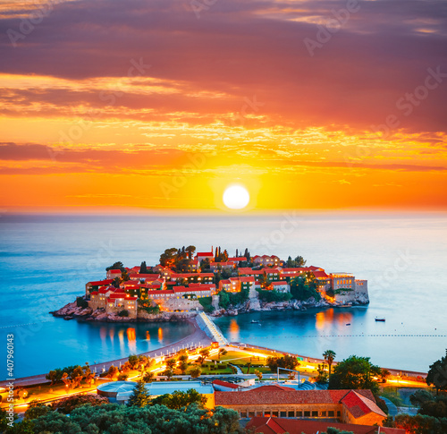 Gorgeous sundown over the small islet Sveti Stefan. Location place Montenegro, Adriatic sea, Europe. © Leonid Tit