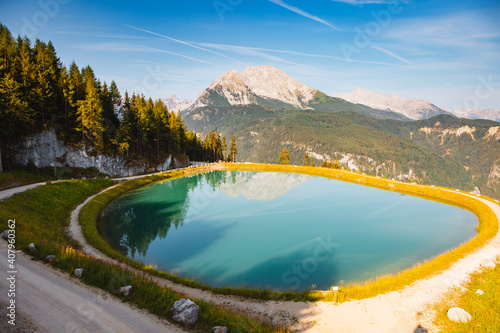Summer scene of alpine pond and mountains on a sunny day. Location place Konigsee lake, Germany alps.