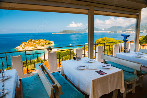 Summer terrace of a Mediterranean restaurant near the island Sveti Stefan. © Leonid Tit