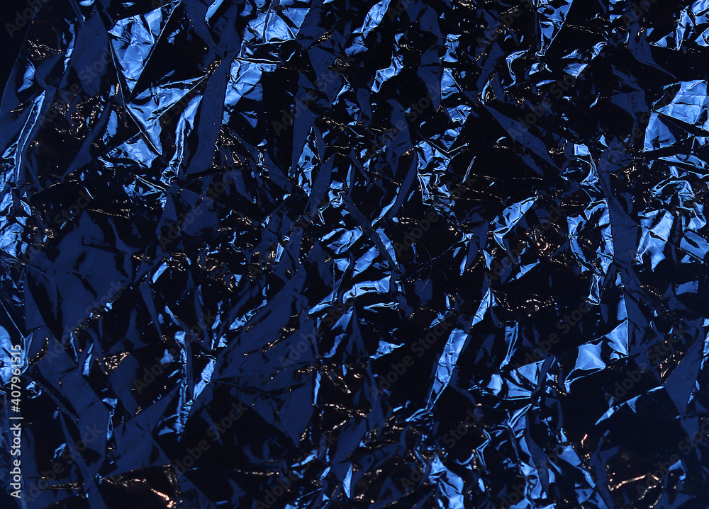 Blue background made of crumpled polyethylene. Abstract blue texture of crumpled plastic film for Wallpaper and backgrounds Blue background made of crumpled polyethylene. Abstract blue texture of crumpled plastic film for Wallpaper and backgrounds