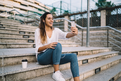 Young woman doing video call using cellphone