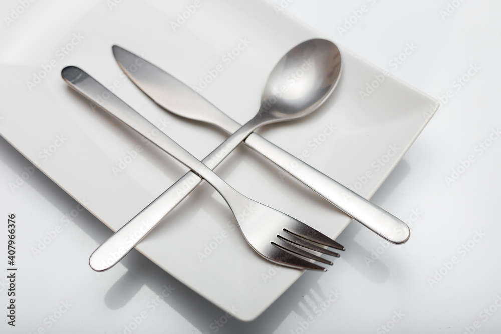 Minimal designed inox cutlery isolated on white background Minimal designed inox cutlery isolated on white background