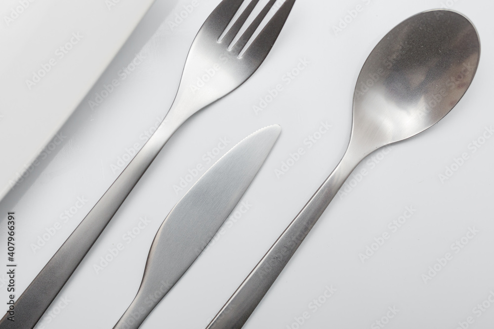 Minimal designed inox cutlery isolated on white background Minimal designed inox cutlery isolated on white background