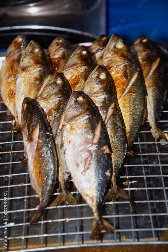 Grilled mackerel fish on a steel grating. Roasted fish. grilled fish. Grilled mackerel fish on a steel grating. Roasted fish. grilled fish.