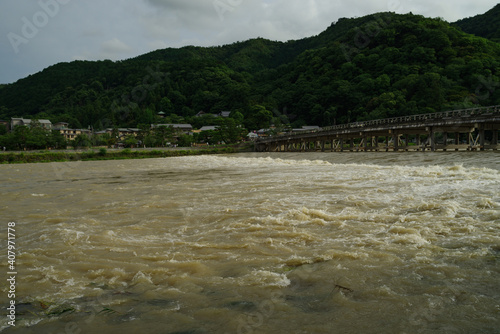京都嵐山・渡月橋と増水した桂川の風景 photo