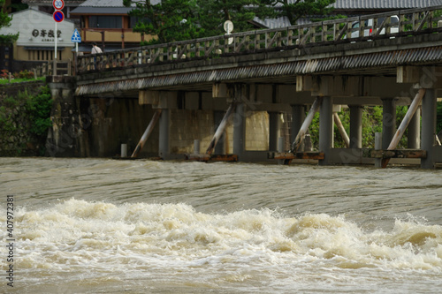 京都嵐山・増水した桂川と渡月橋 photo
