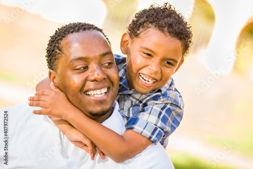 Happy African American Father and Mixed Race Son Playing At The Park