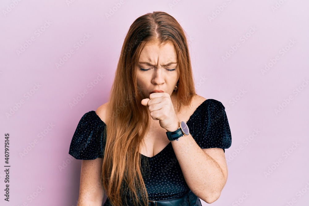 Young beautiful redhead woman wearing elegant and sexy look feeling unwell and coughing as symptom for cold or bronchitis. health care concept. Young beautiful redhead woman wearing elegant and sexy look feeling unwell and coughing as symptom for cold or bronchitis. health care concept.