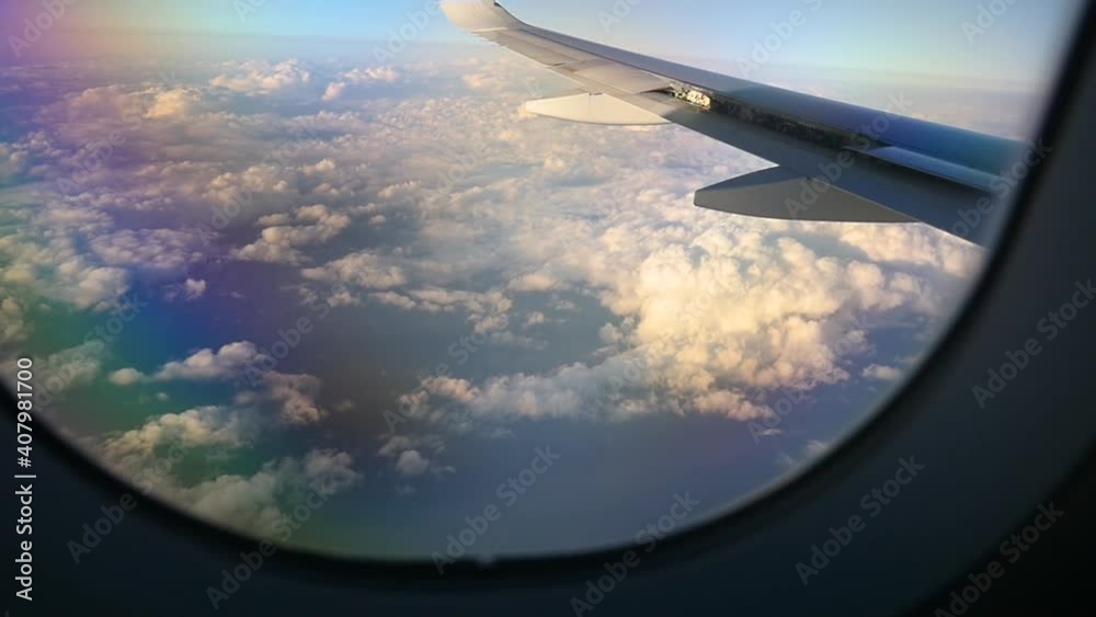 Airplane passenger window view flying through the clouds. Airplane passenger window view flying through the clouds.