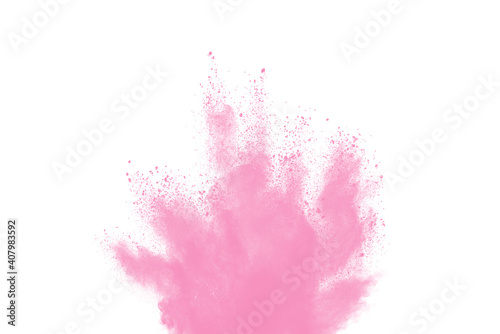 Freeze motion of pink color powder exploding on white background. 