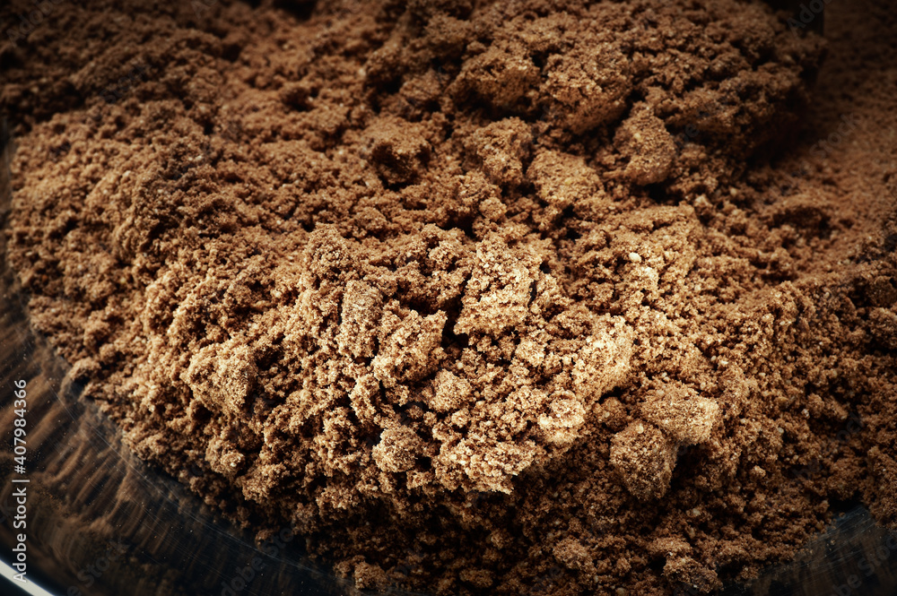 Close-up chocolate ground in a pan with an iron spoon. Ingredients for making pie. Close-up chocolate ground in a pan with an iron spoon. Ingredients for making pie.