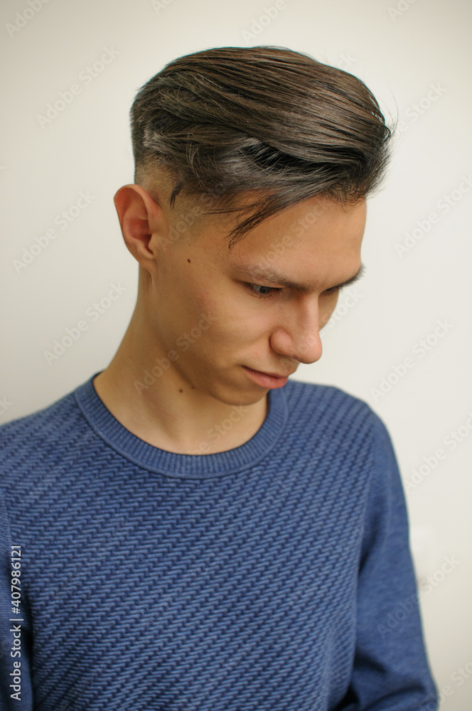 Short haircut on a young man with dark hair Short haircut on a young man with dark hair