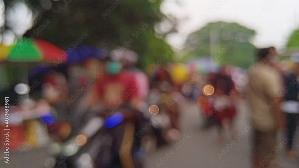blurred outfocused defocused bokeh view of Sunday morning activty of people in Surabaya Indonesia around National Great Mosque with people gathering, jogging, sightseeing and shopping at local tempora blurred outfocused defocused bokeh view of Sunday morning activty of people in Surabaya Indonesia around National Great Mosque with people gathering, jogging, sightseeing and shopping at local tempora