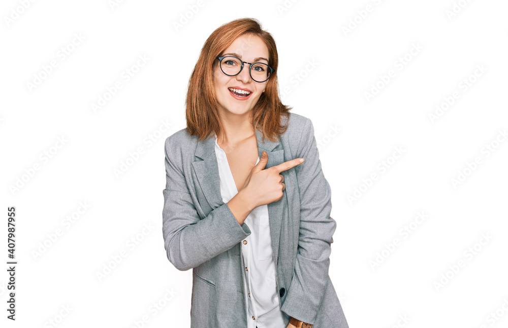 Young caucasian woman wearing business style and glasses cheerful with a smile on face pointing with hand and finger up to the side with happy and natural expression Young caucasian woman wearing business style and glasses cheerful with a smile on face pointing with hand and finger up to the side with happy and natural expression