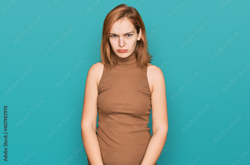 Young caucasian woman wearing casual clothes skeptic and nervous, frowning upset because of problem. negative person. Young caucasian woman wearing casual clothes skeptic and nervous, frowning upset because of problem. negative person.