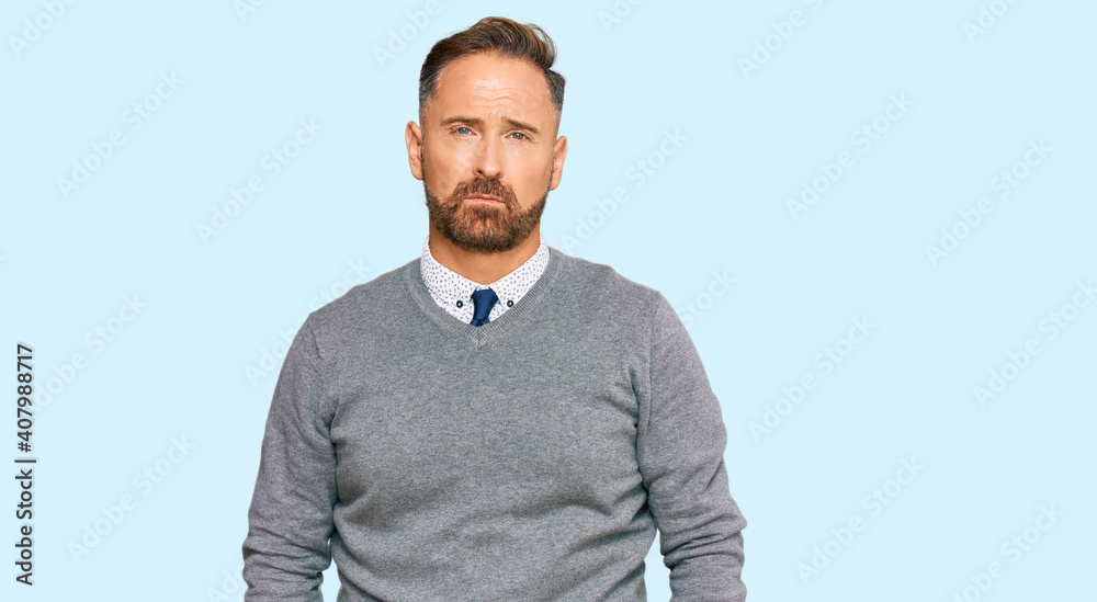 Handsome middle age man wearing business clothes depressed and worry for distress, crying angry and afraid. sad expression. Handsome middle age man wearing business clothes depressed and worry for distress, crying angry and afraid. sad expression.