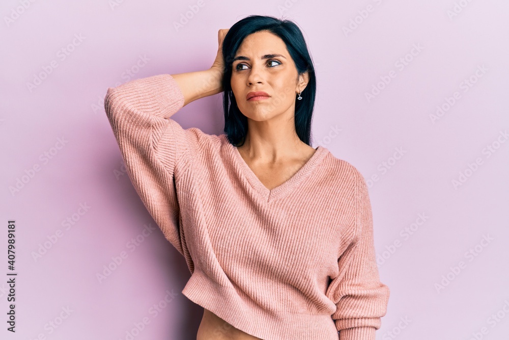 Young caucasian woman wearing casual clothes confuse and wondering about question. uncertain with doubt, thinking with hand on head. pensive concept. Young caucasian woman wearing casual clothes confuse and wondering about question. uncertain with doubt, thinking with hand on head. pensive concept.