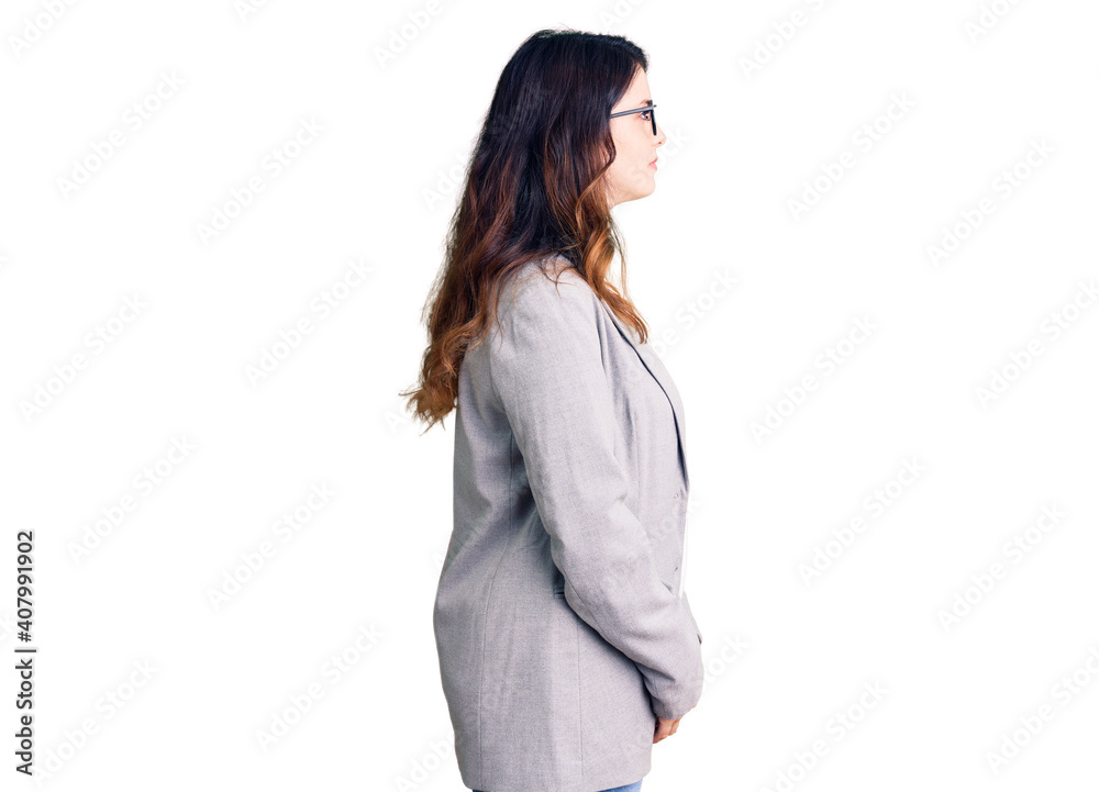 Beautiful young brunette woman wearing business clothes and glasses looking to side, relax profile pose with natural face with confident smile. Beautiful young brunette woman wearing business clothes and glasses looking to side, relax profile pose with natural face with confident smile.