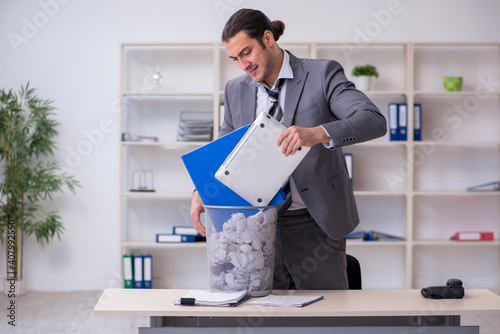 Wallpaper Mural Fired young businessman with recycle bin in the office Torontodigital.ca