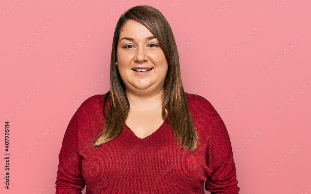 Beautiful brunette plus size woman wearing casual clothes with a happy and cool smile on face. lucky person. Beautiful brunette plus size woman wearing casual clothes with a happy and cool smile on face. lucky person.