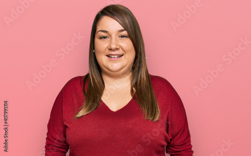 Beautiful brunette plus size woman wearing casual clothes with a happy and cool smile on face. lucky person.
