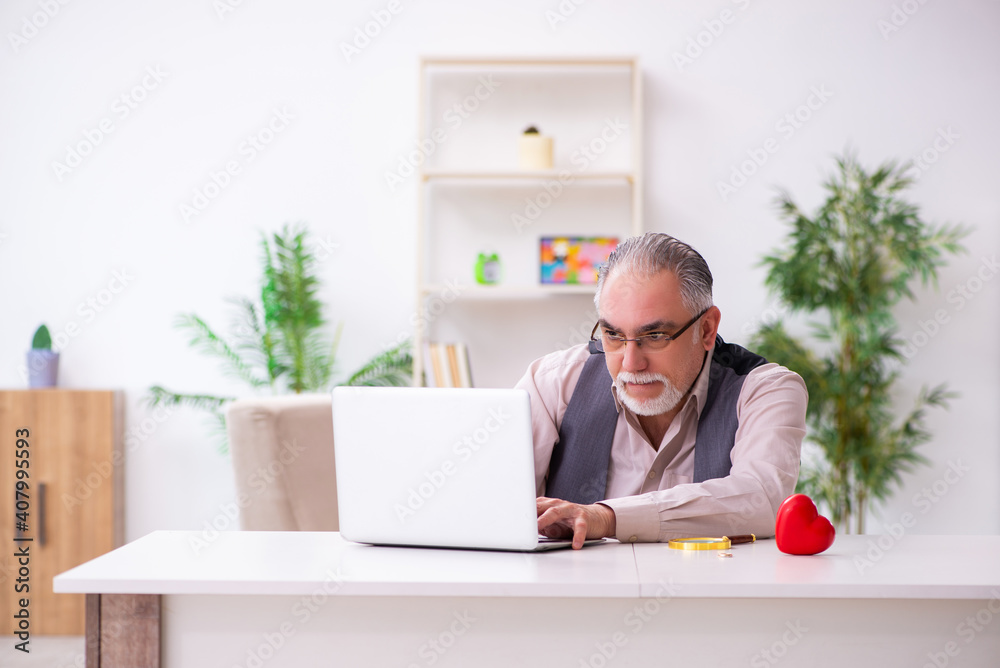 Old man doing marriage proposal via internet Old man doing marriage proposal via internet