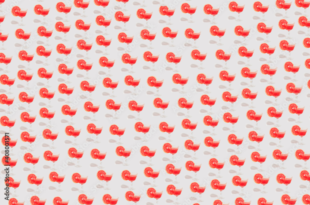 minimally lined cocktail glasses with a red drink. minimally lined cocktail glasses with a red drink.