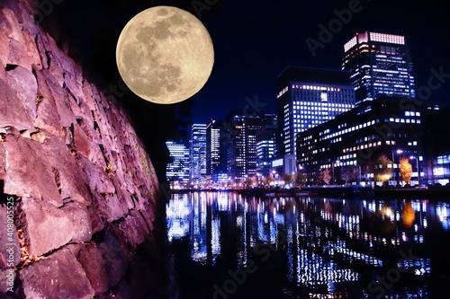 シティスケープと満月と水面の夜景