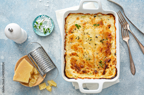 Cheesy scalloped potatoes with thyme and parmesan photo