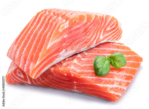 Fresh raw salmon fillets  decorated with green basil.