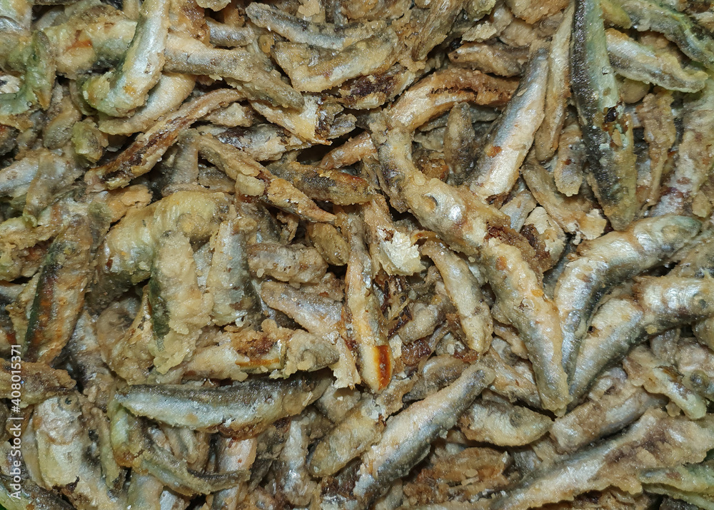 Many fried anchovy fish at the restaurant