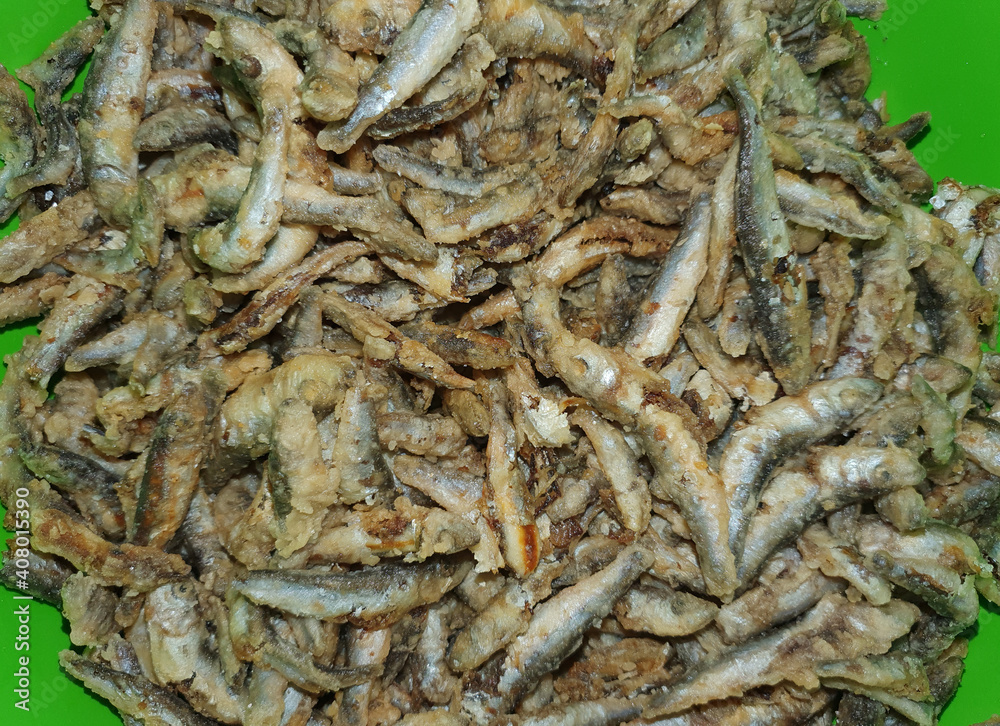 Many fried anchovy fish at the restaurant Many fried anchovy fish at the restaurant