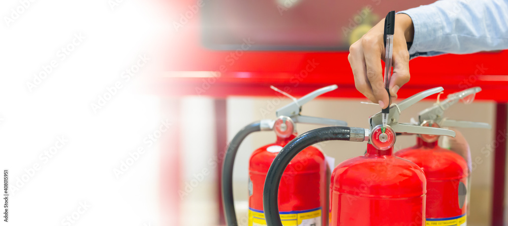 Expert engineers inspect fire extinguishers to be ready for use.