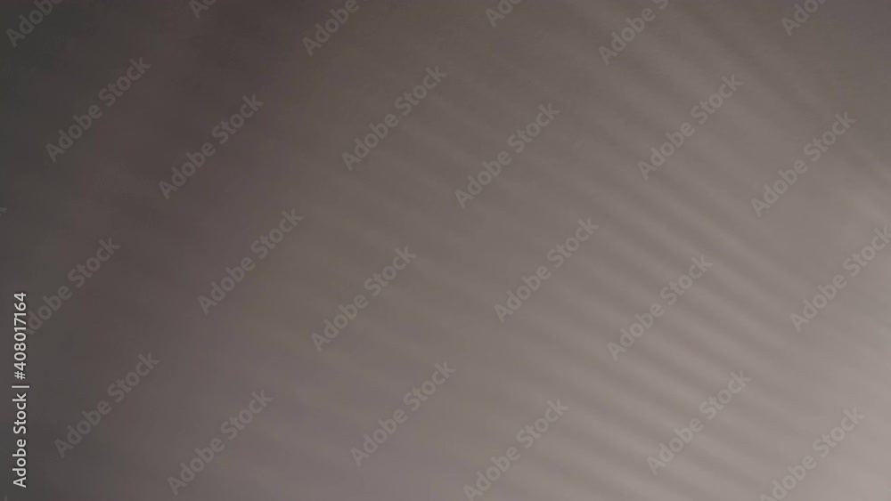 Blurry dark shadows moving on the wall. Spooky shadow art noise texture. closeup the motion of shadow batten of lath light on white wall texture background. Slow motion video. stock footage Blurry dark shadows moving on the wall. Spooky shadow art noise texture. closeup the motion of shadow batten of lath light on white wall texture background. Slow motion video. stock footage