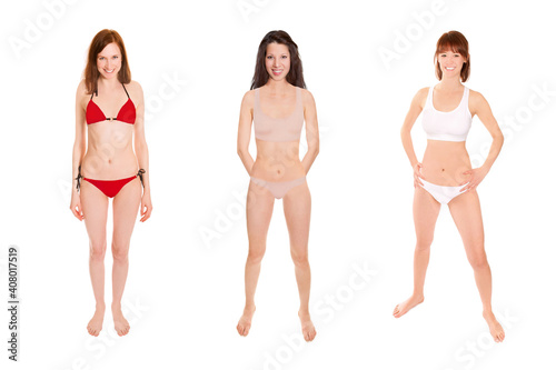 Full length portraits of three young happy women wearing different bikinis, isolated in front of white studio background